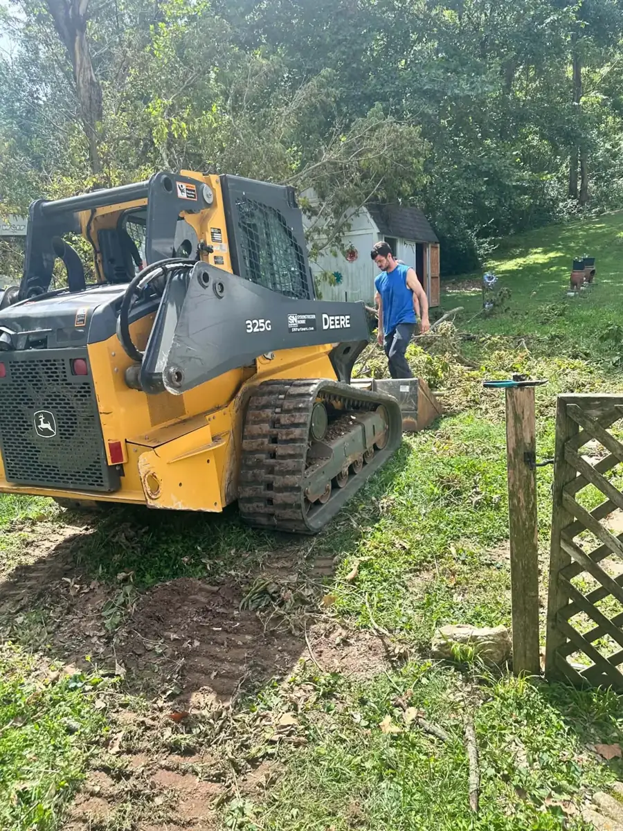 Brush cleanup with a track loader
